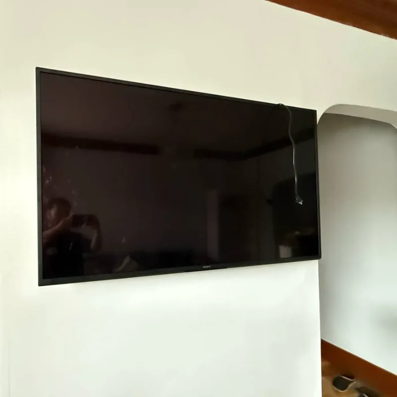Sony TV mounted on a white wall in a Chicago condo