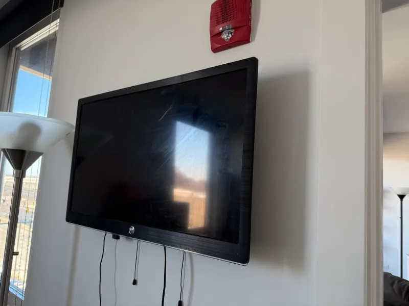 TV mounted on an office wall in a Chicago high-rise