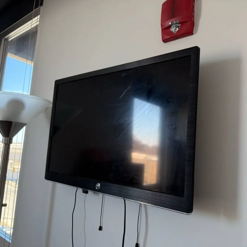 TV mounted on a wall beside the window in a Chicago office
