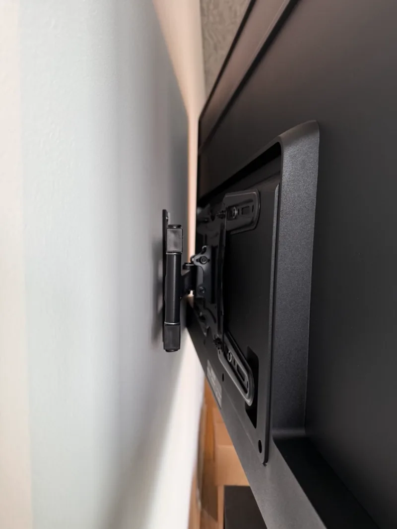 Close-up of a TV wall mount arm during a Chicago installation